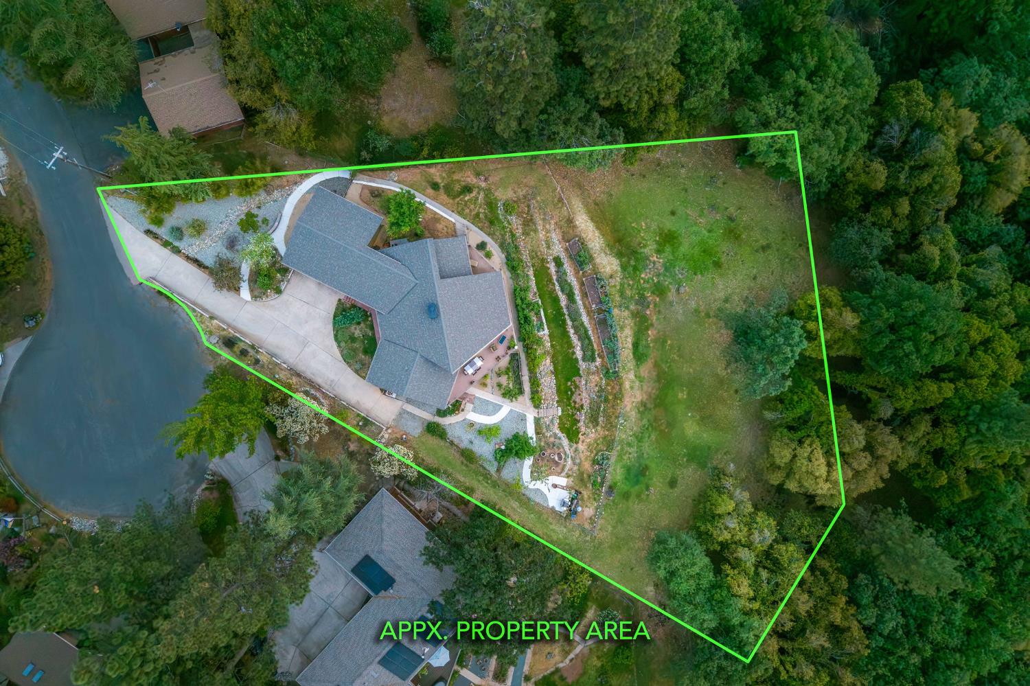 16105 John Way Grass Valley, CA 95949 - Photo 67 of 71 an aerial view of a house with a yard and lake view