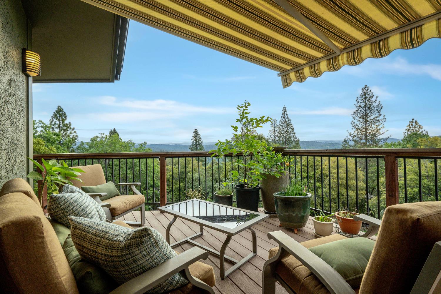 16105 John Way Grass Valley, CA 95949 - Photo 7 of 71 a balcony with furniture and a potted plant