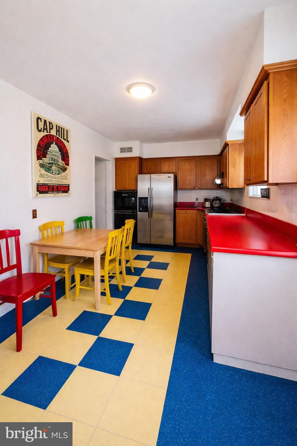 9210 Worth Avenue Silver Spring, MD 20901 - Photo 7 of 20 a room with furniture and a table