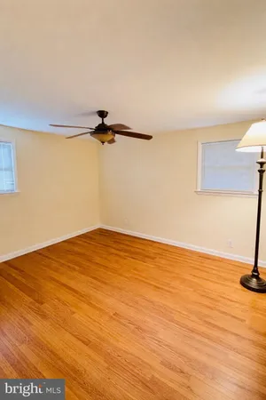 a view of a room with wooden floor