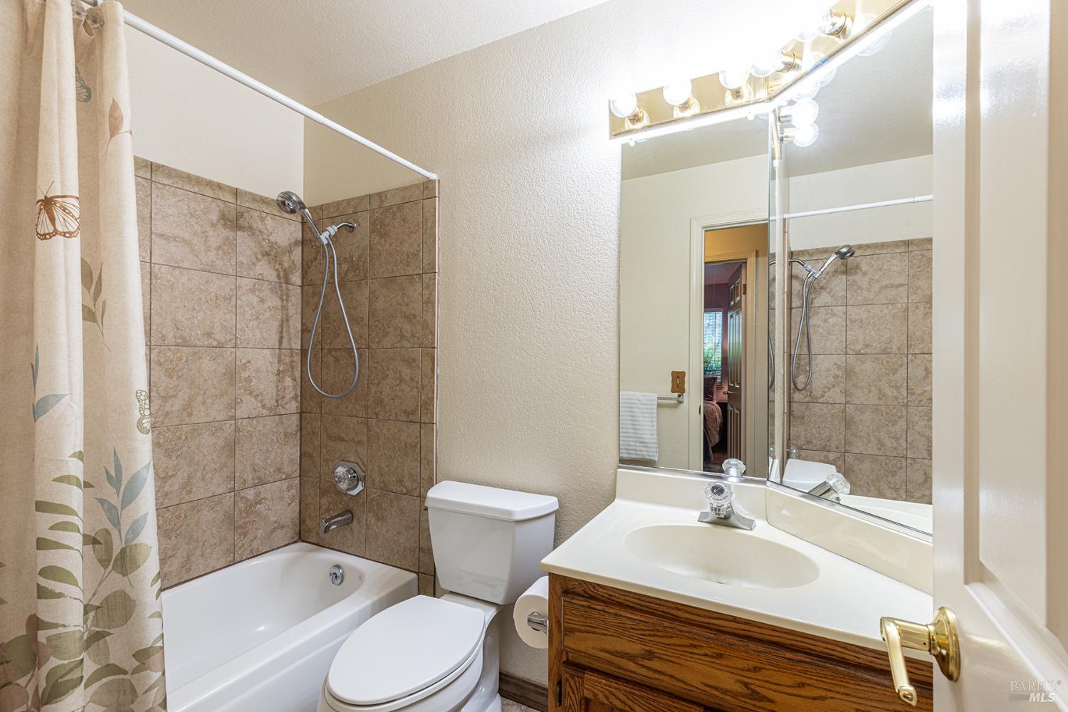 1935 Seville Street Santa Rosa, CA 95403 - Photo 16 of 30 a bathroom with a sink toilet and shower