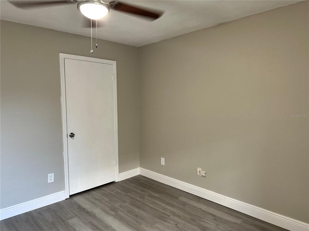1025 South Hiawassee Road, Unit 2214 Orlando, FL 32835 - Photo 15 of 26 a view of an empty room with wooden floor