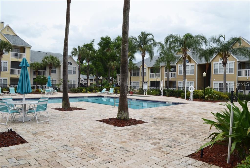 1025 South Hiawassee Road, Unit 2214 Orlando, FL 32835 - Photo 22 of 26 a view of a street with palm trees