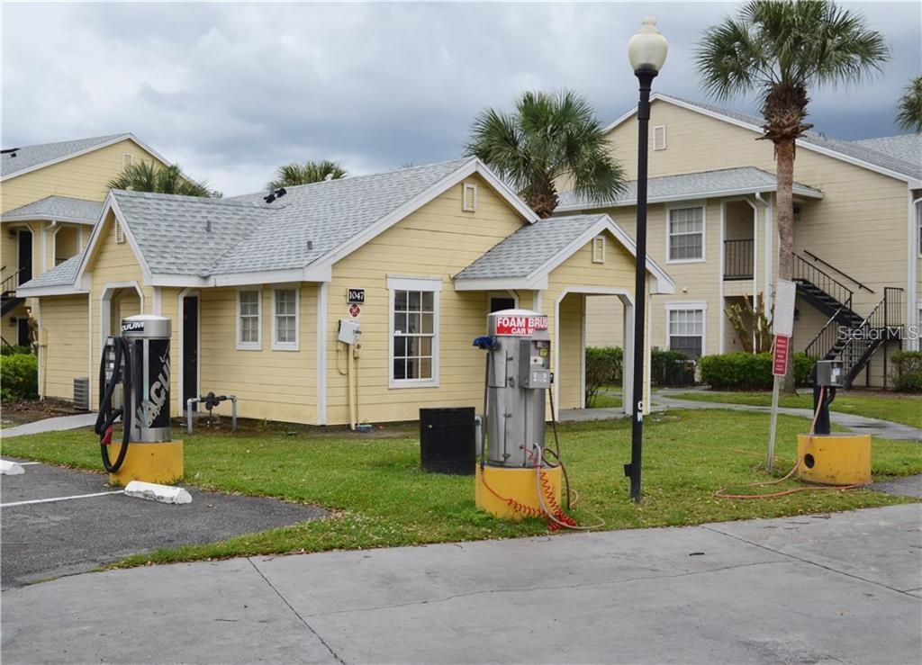 1025 South Hiawassee Road, Unit 2214 Orlando, FL 32835 - Photo 24 of 26 a front view of a house with garden