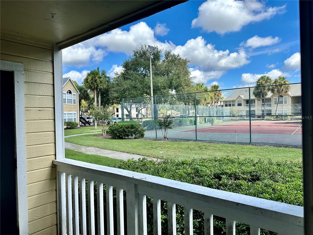 1025 South Hiawassee Road, Unit 2214 Orlando, FL 32835 - Photo 10 of 26 a view of a yard with a porch