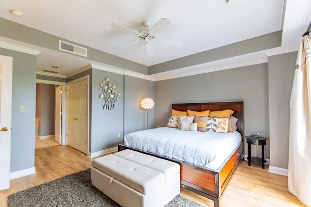 a bedroom with a bed and a television