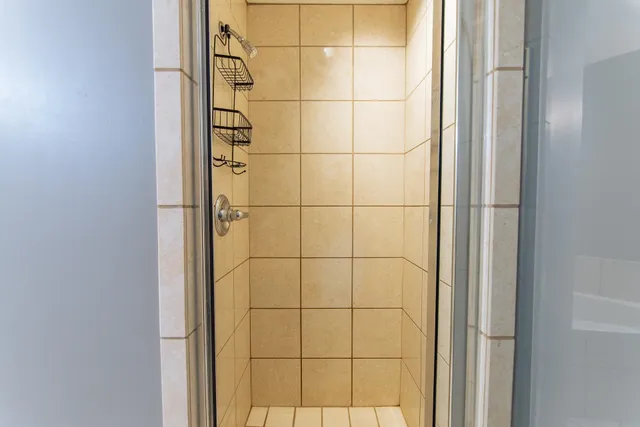 a view of storage and utility room with washer and dryer
