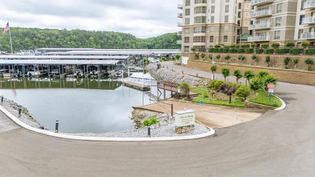 an aerial view of a house with a lake view