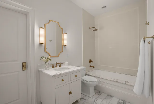 a view of a house with a yard table and chairs