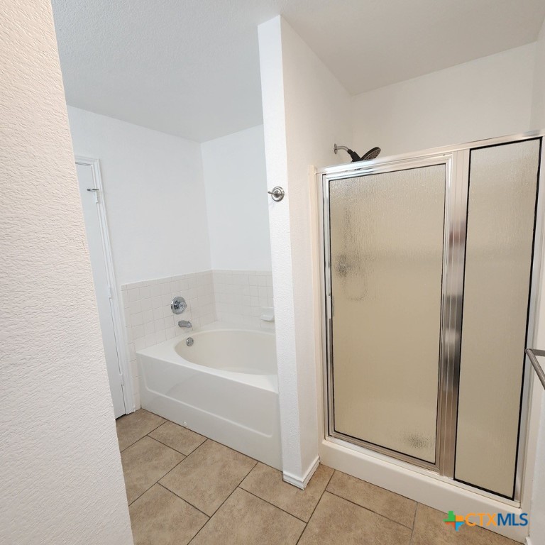 1111 Travis Circle Copperas Cove, TX 76522 - Photo 16 of 24 a bathroom with a bathtub and a shower