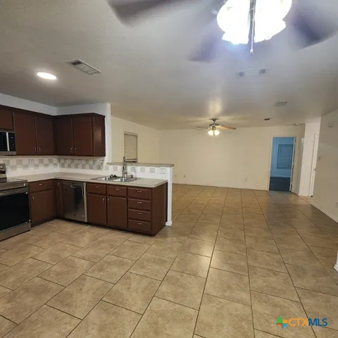 a large bathroom with a sink and a mirror