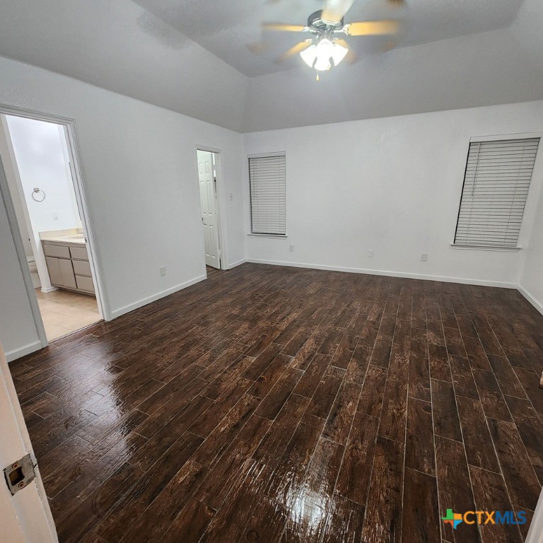 1111 Travis Circle Copperas Cove, TX 76522 - Photo 9 of 24 a view of a livingroom with wooden floor and a ceiling fan