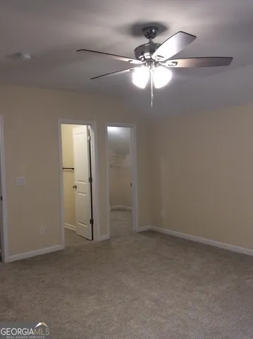 en empty room with fan and fan