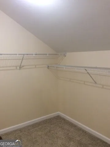 a view of a room with racks on the wall