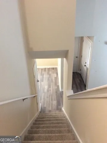 a view of a room with a staircase