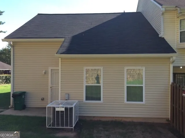 a backyard of a house with seating space