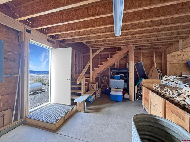 a view of a hallway with wooden shelves