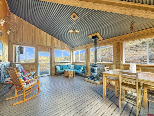 a outdoor space with patio the couches and pool with wooden floor