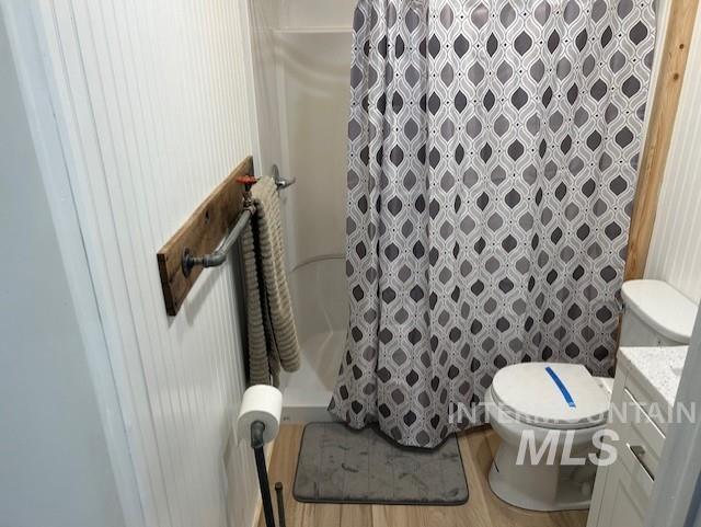 820 Sweeney Road Elk City, ID 83525 - Photo 18 of 45 Full bath with a shower stall, vanity, and light wood finished floors