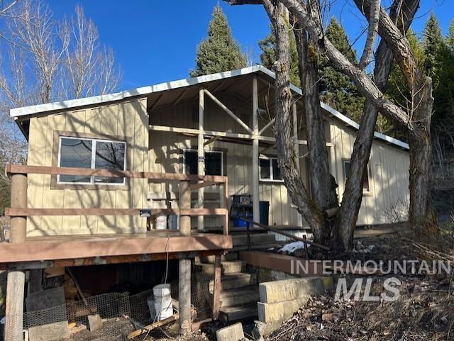 820 Sweeney Road Elk City, ID 83525 - Photo 33 of 45 Rear view of house with a deck