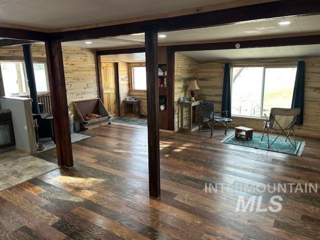 820 Sweeney Road Elk City, ID 83525 - Photo 10 of 45 Sitting room with wood walls, beam ceiling, dark wood finished floors, and recessed lighting