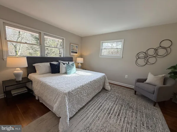 a bedroom with a large bed and a window