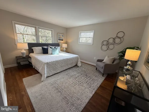 a bedroom with two beds and a window