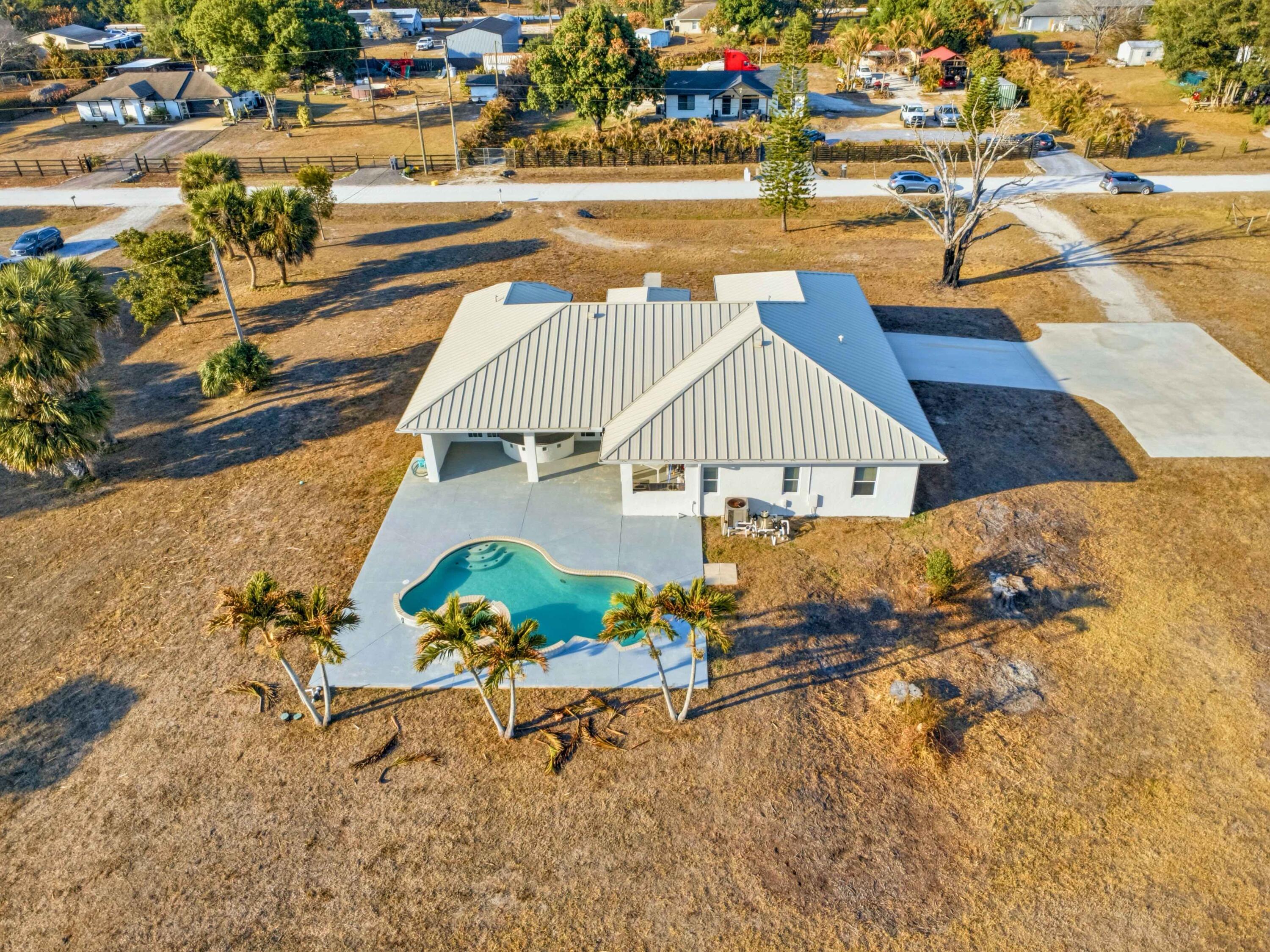 18852 43rd Road North The Acreage, FL 33470 - Photo 1 of 24 a view of a terrace with chairs