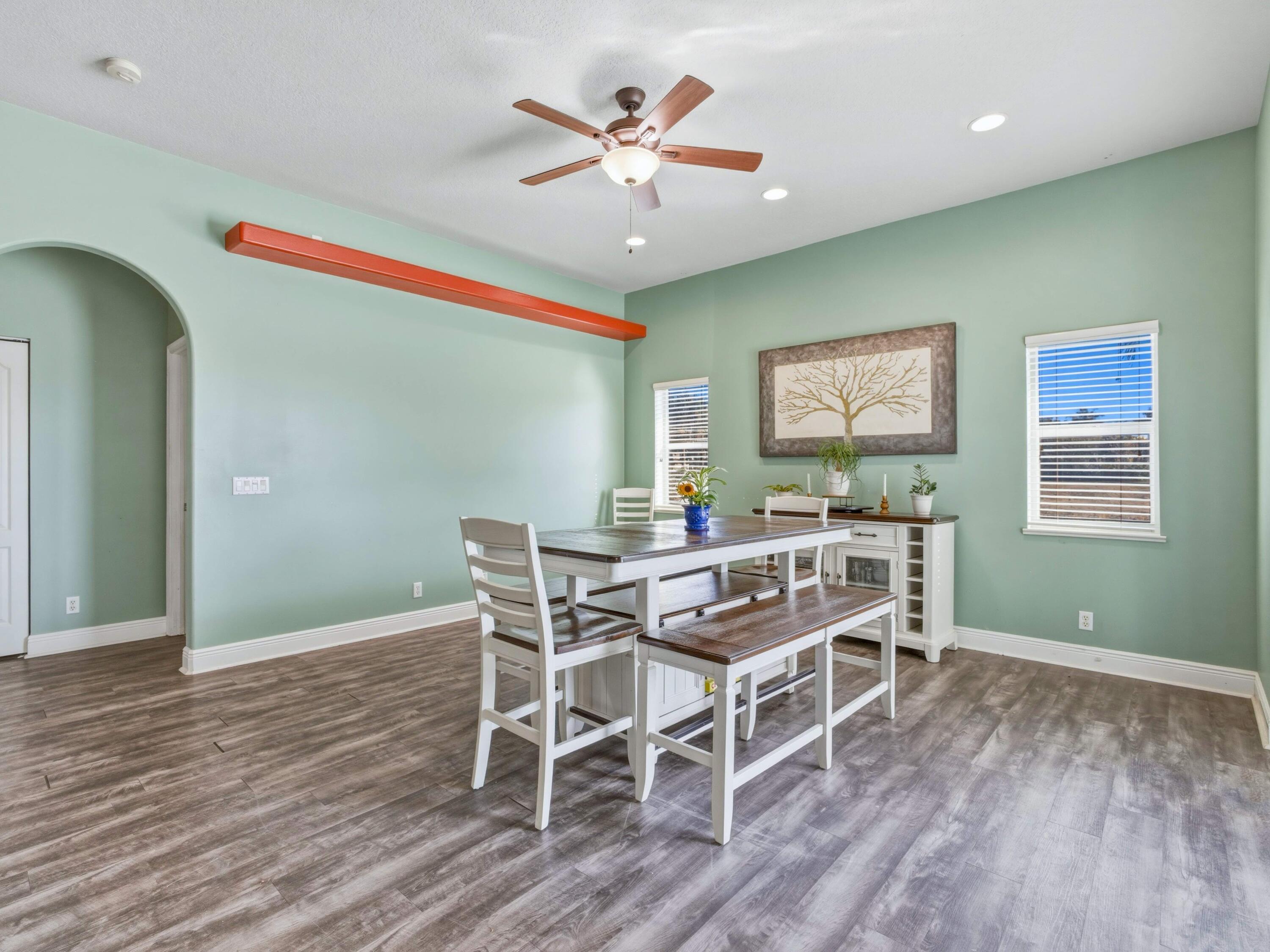 18852 43rd Road North The Acreage, FL 33470 - Photo 12 of 24 a view of a dining room with furniture and wooden floor