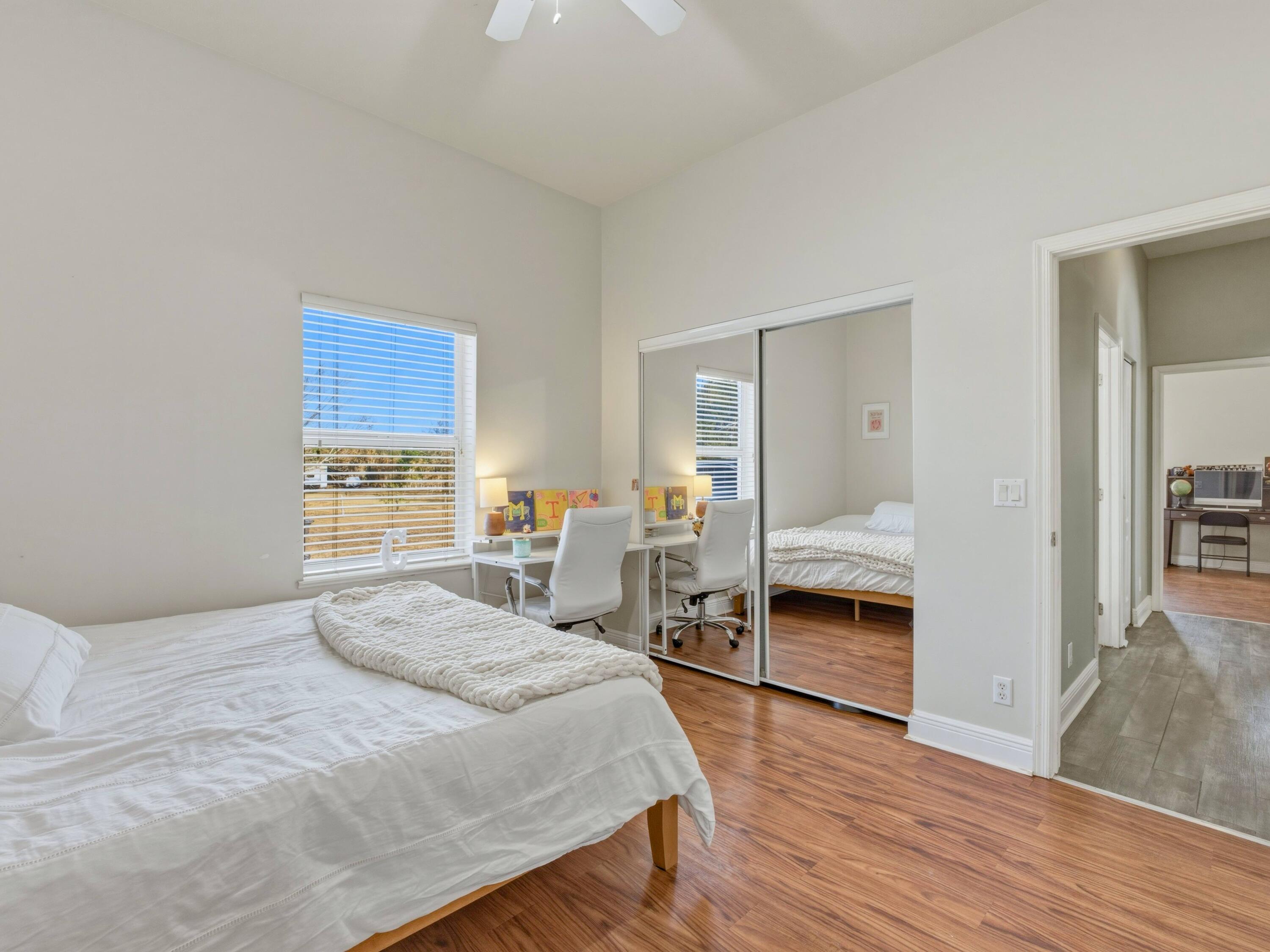 18852 43rd Road North The Acreage, FL 33470 - Photo 14 of 24 a bedroom with a bed and a view of kitchen