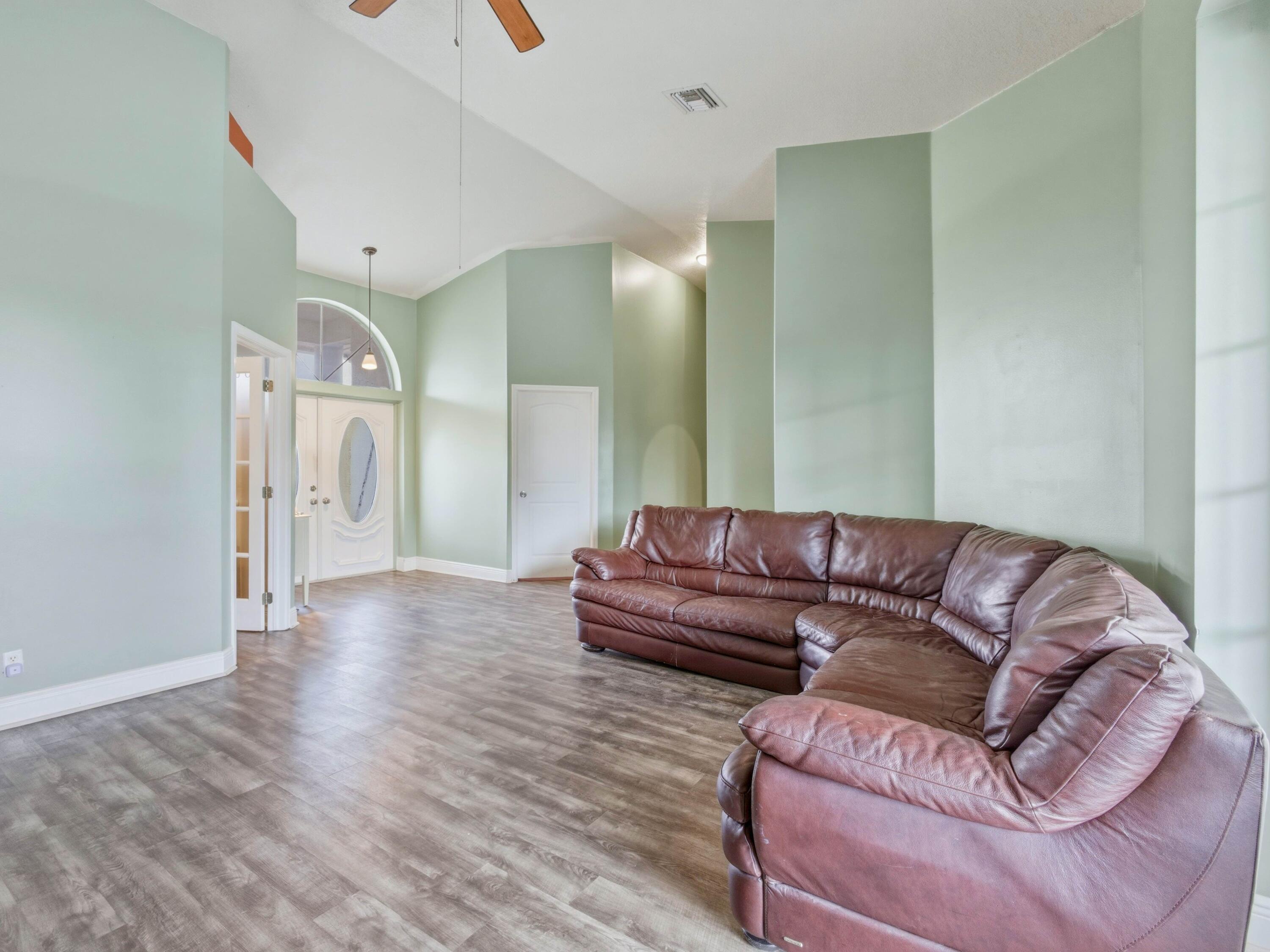 18852 43rd Road North The Acreage, FL 33470 - Photo 19 of 24 a living room with furniture and a couch