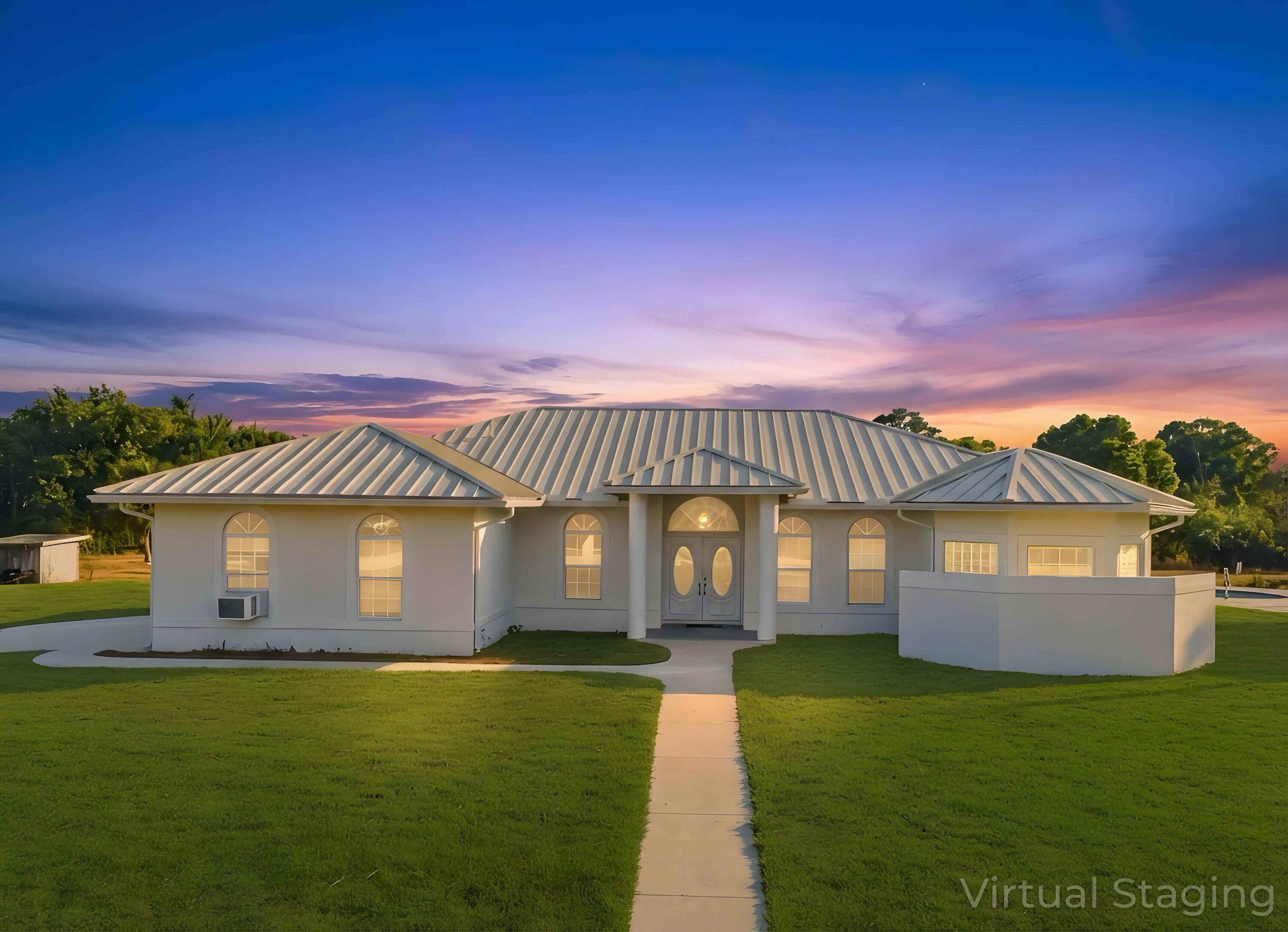 18852 43rd Road North The Acreage, FL 33470 - Photo 3 of 24 a front view of a house with a garden