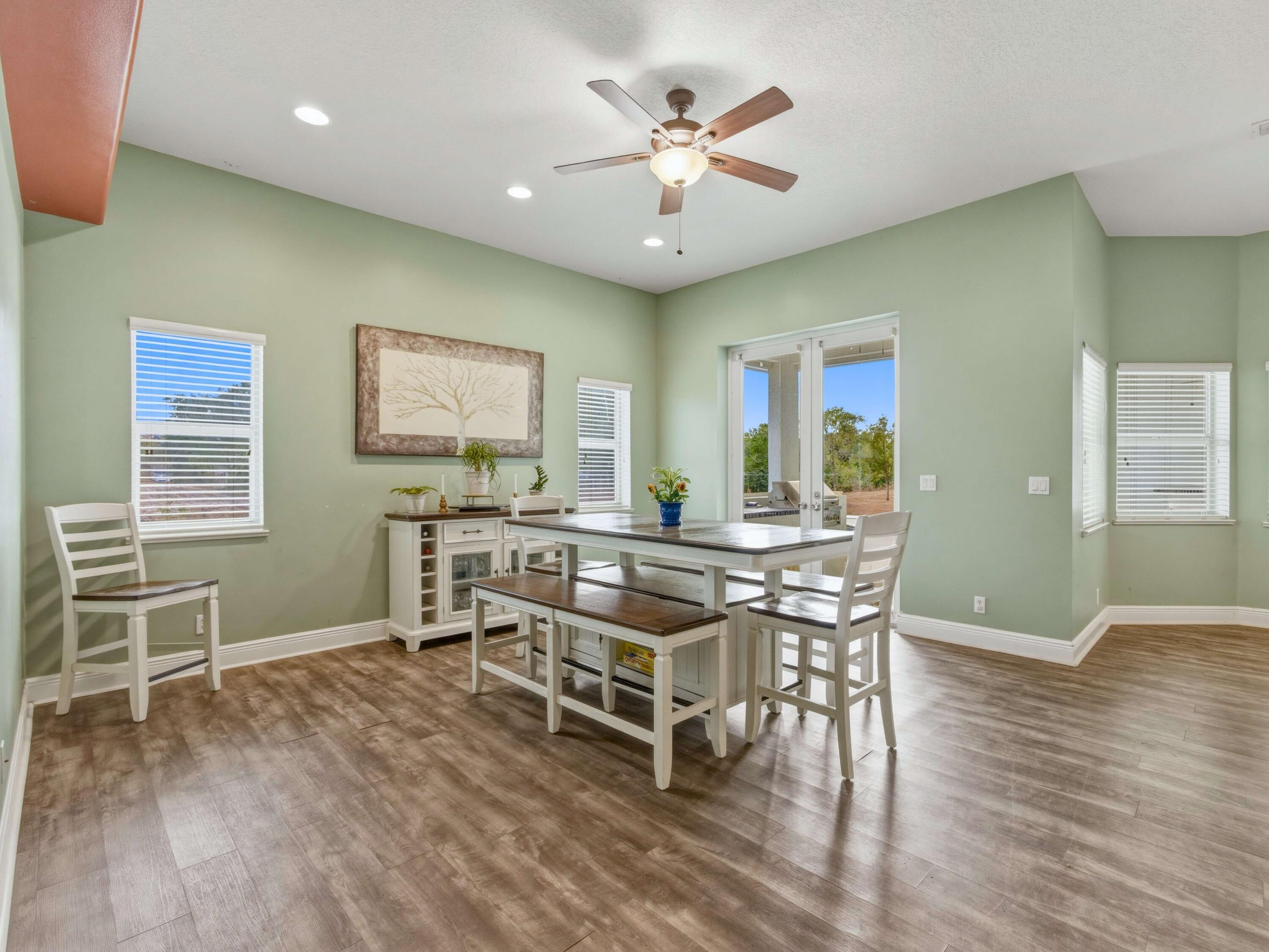 18852 43rd Road North The Acreage, FL 33470 - Photo 8 of 24 a view of a dining room with furniture and wooden floor