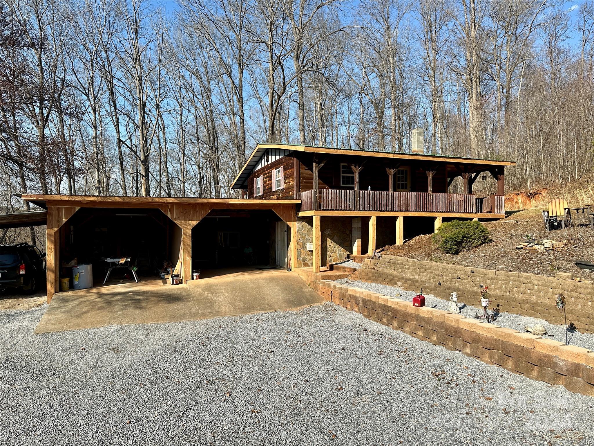 4453 Scott Road Morganton, NC 28655 - Photo 1 of 44 a front view of a house with a yard covered with snow in front of house