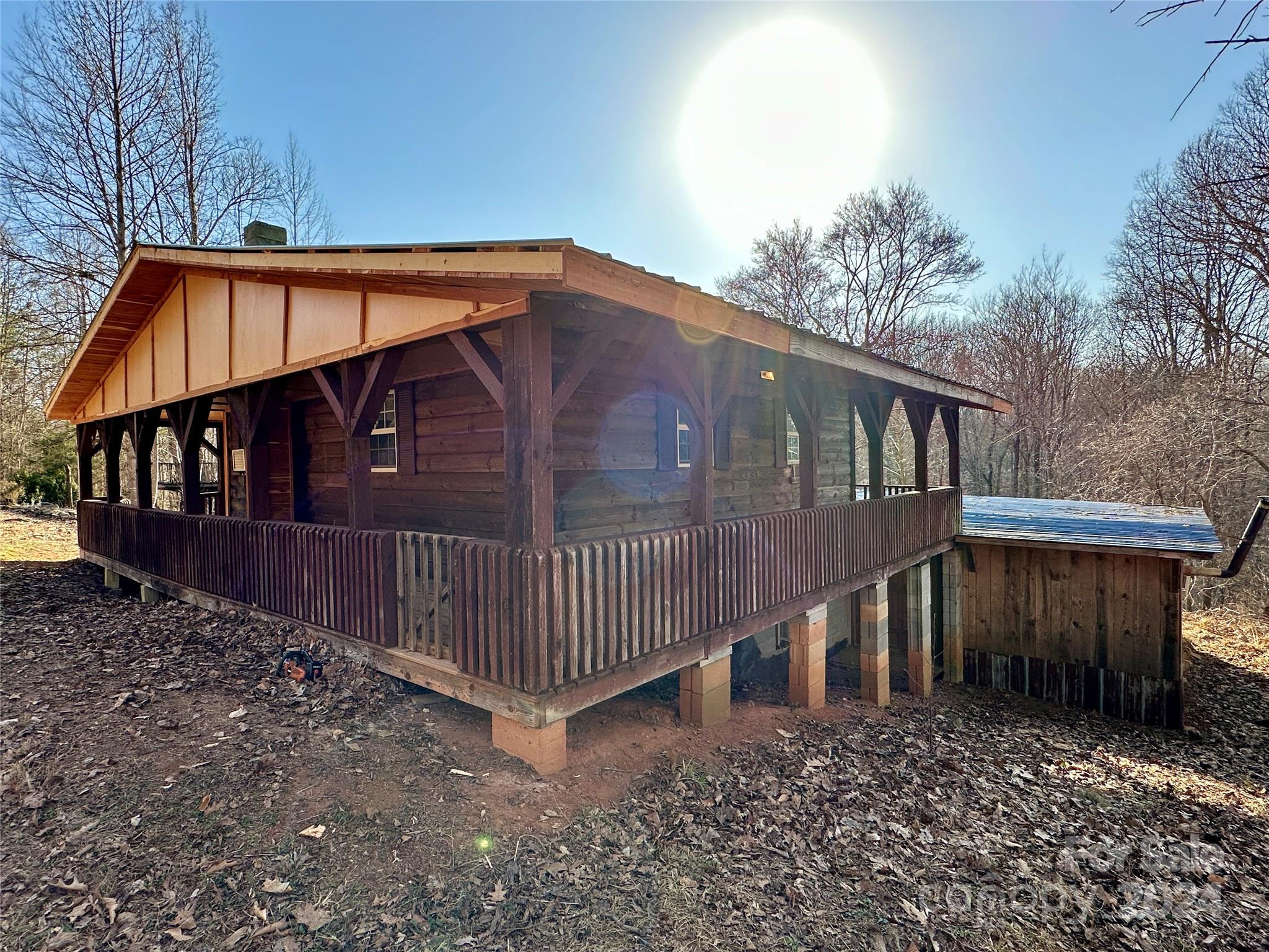 4453 Scott Road Morganton, NC 28655 - Photo 11 of 44 a view of a house with wooden fence