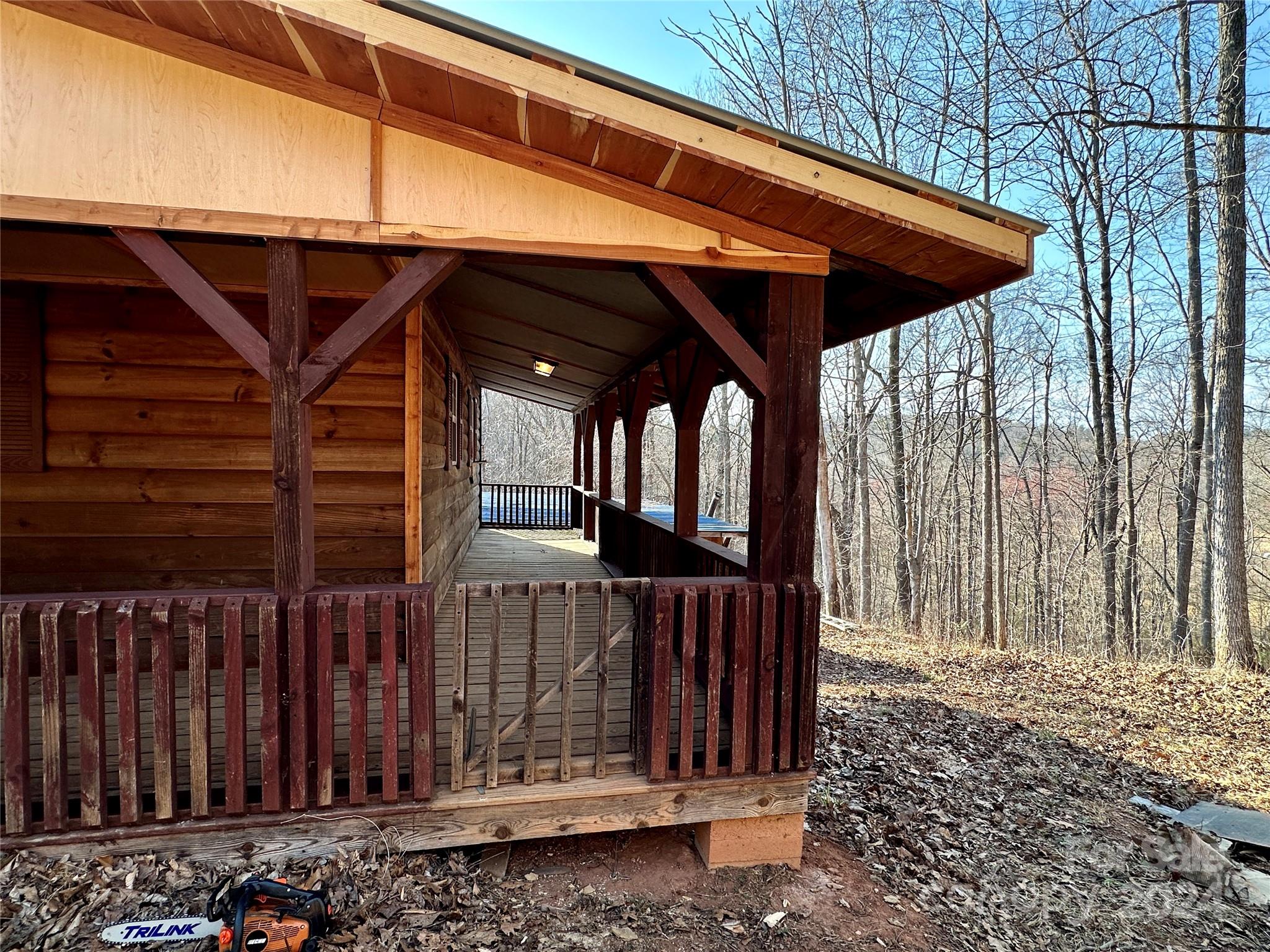 4453 Scott Road Morganton, NC 28655 - Photo 12 of 44 a view of a small barn with wooden wall and roof
