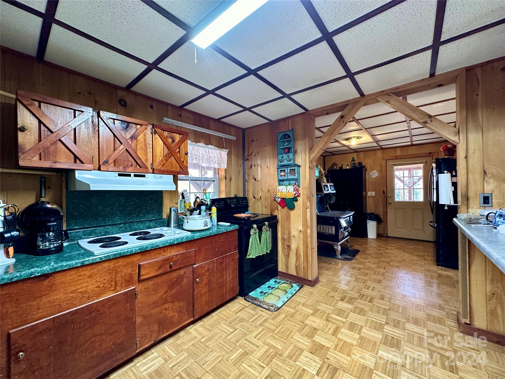 4453 Scott Road Morganton, NC 28655 - Photo 19 of 44 a kitchen with stainless steel appliances granite countertop sink stove and cabinets