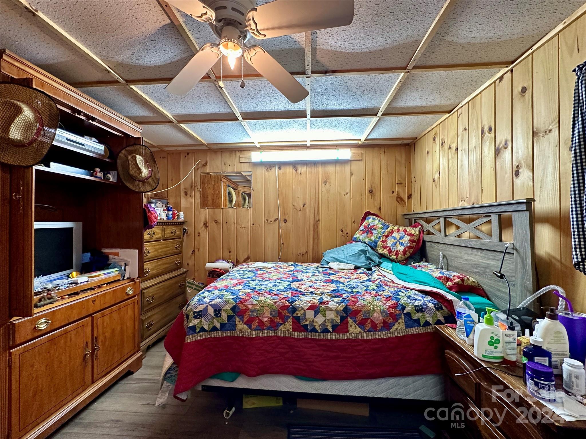 4453 Scott Road Morganton, NC 28655 - Photo 29 of 44 a bed room with a bed and a tv