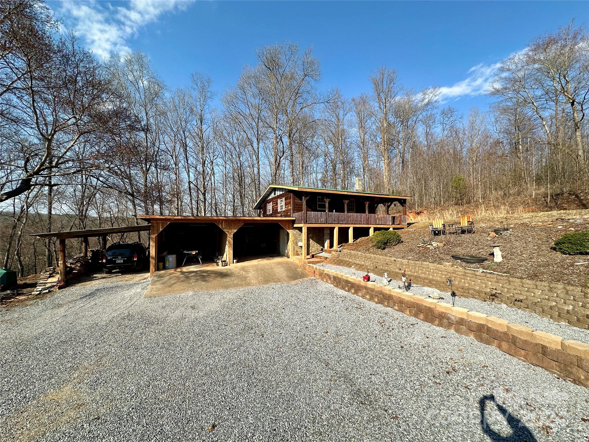 4453 Scott Road Morganton, NC 28655 - Photo 3 of 44 a view of a house with snow on the side of the road
