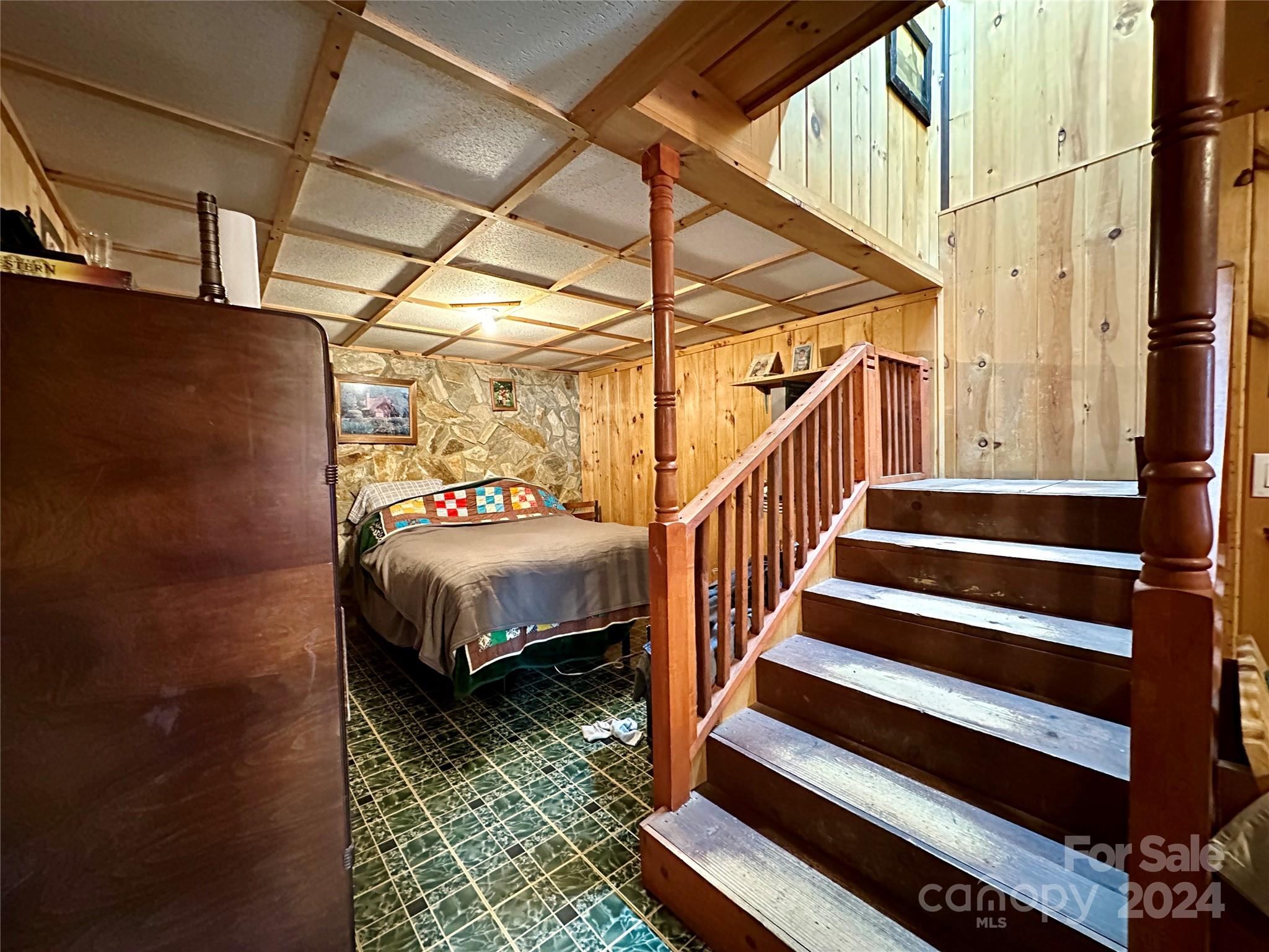 4453 Scott Road Morganton, NC 28655 - Photo 32 of 44 a bedroom with wooden floor and a bed