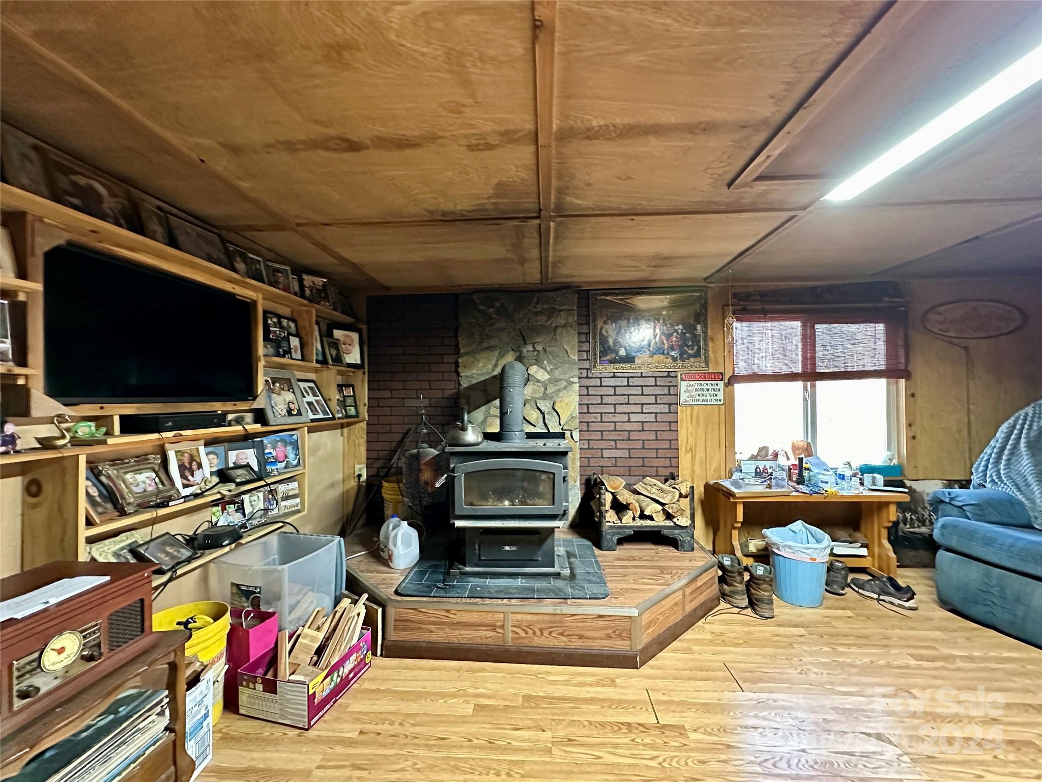4453 Scott Road Morganton, NC 28655 - Photo 37 of 44 a living room with furniture and a flat screen tv