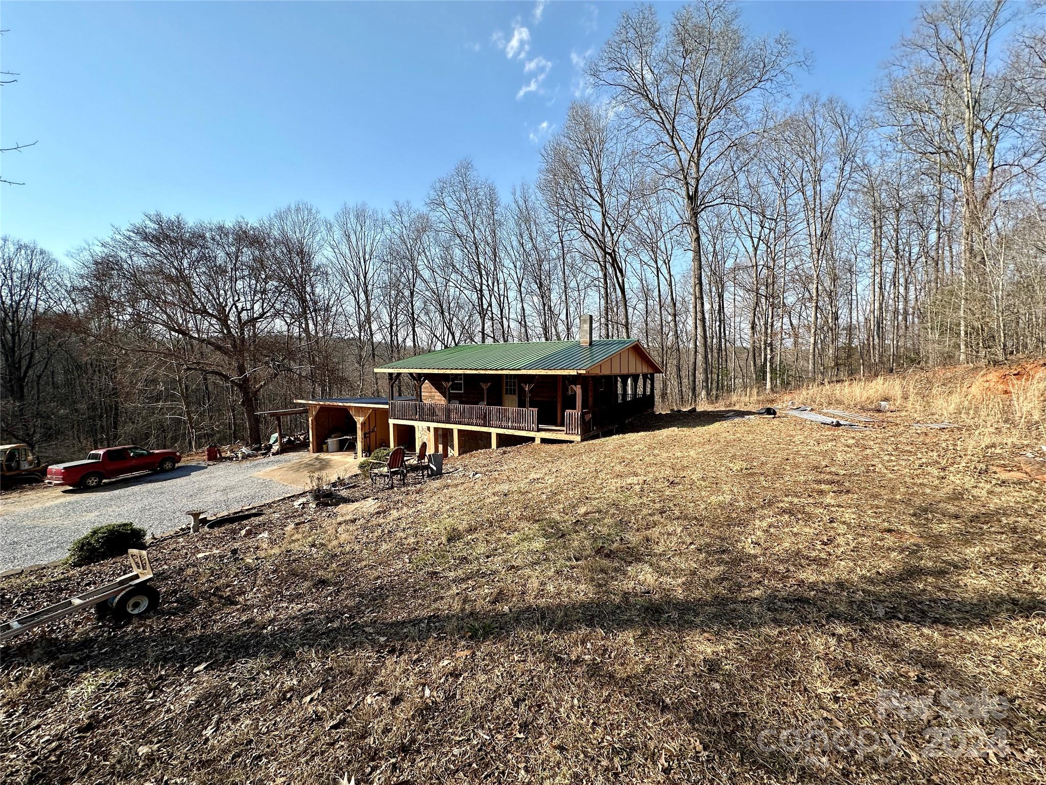4453 Scott Road Morganton, NC 28655 - Photo 4 of 44 a view of a house with a yard covered in snow
