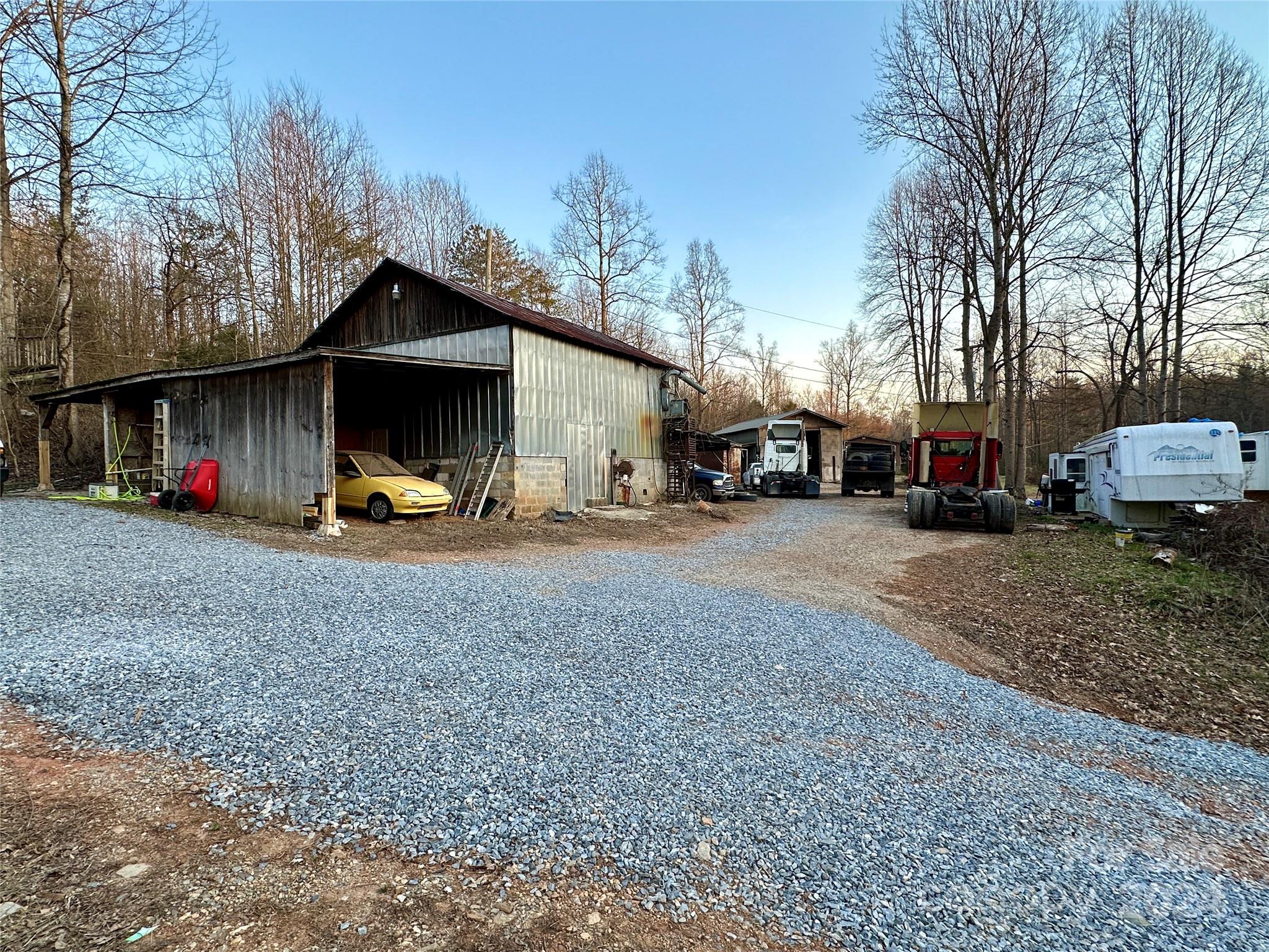 4453 Scott Road Morganton, NC 28655 - Photo 43 of 44 a view of outdoor space with deck and car parked