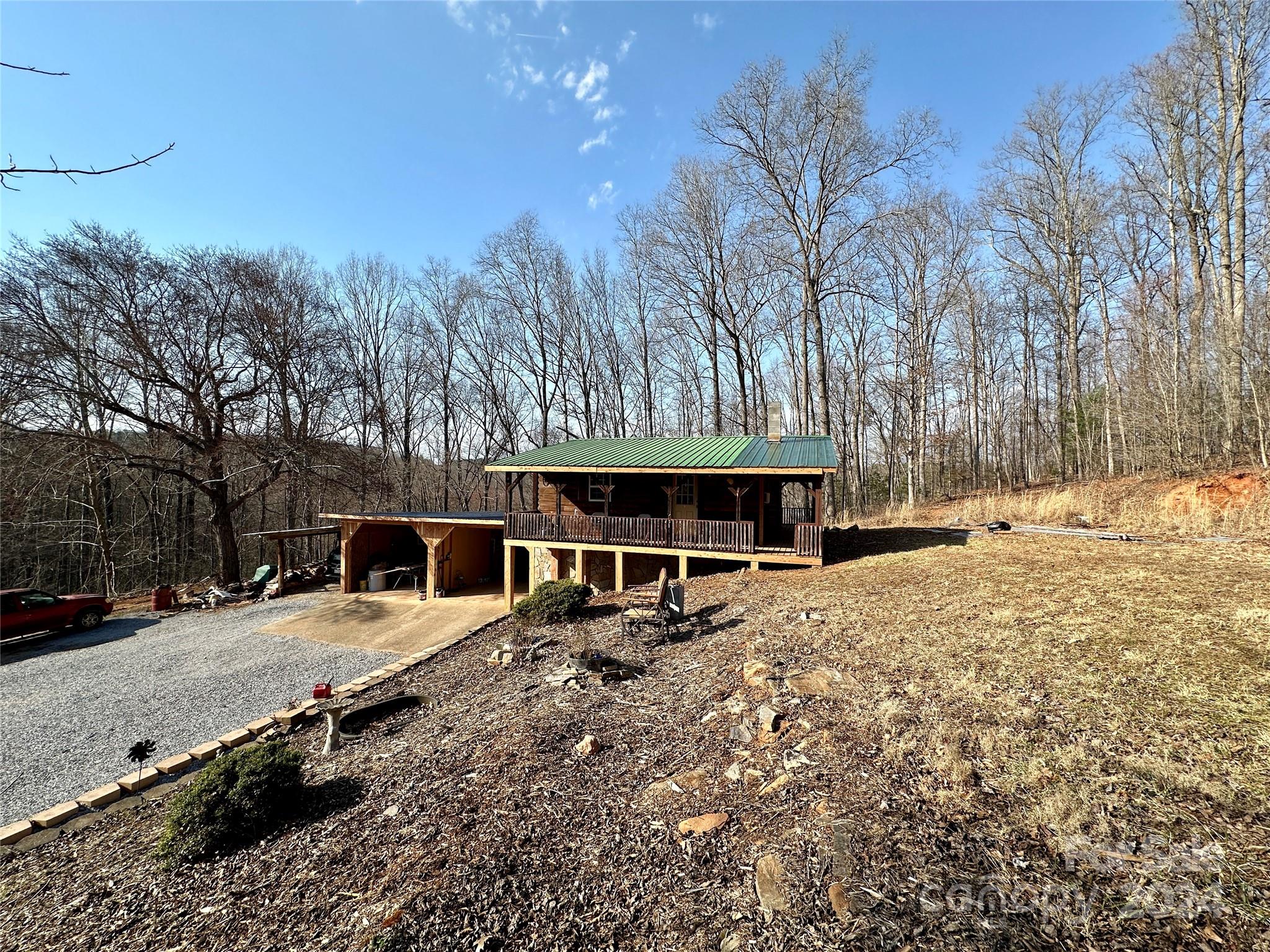4453 Scott Road Morganton, NC 28655 - Photo 5 of 44 a view of a house with a yard covered in snow