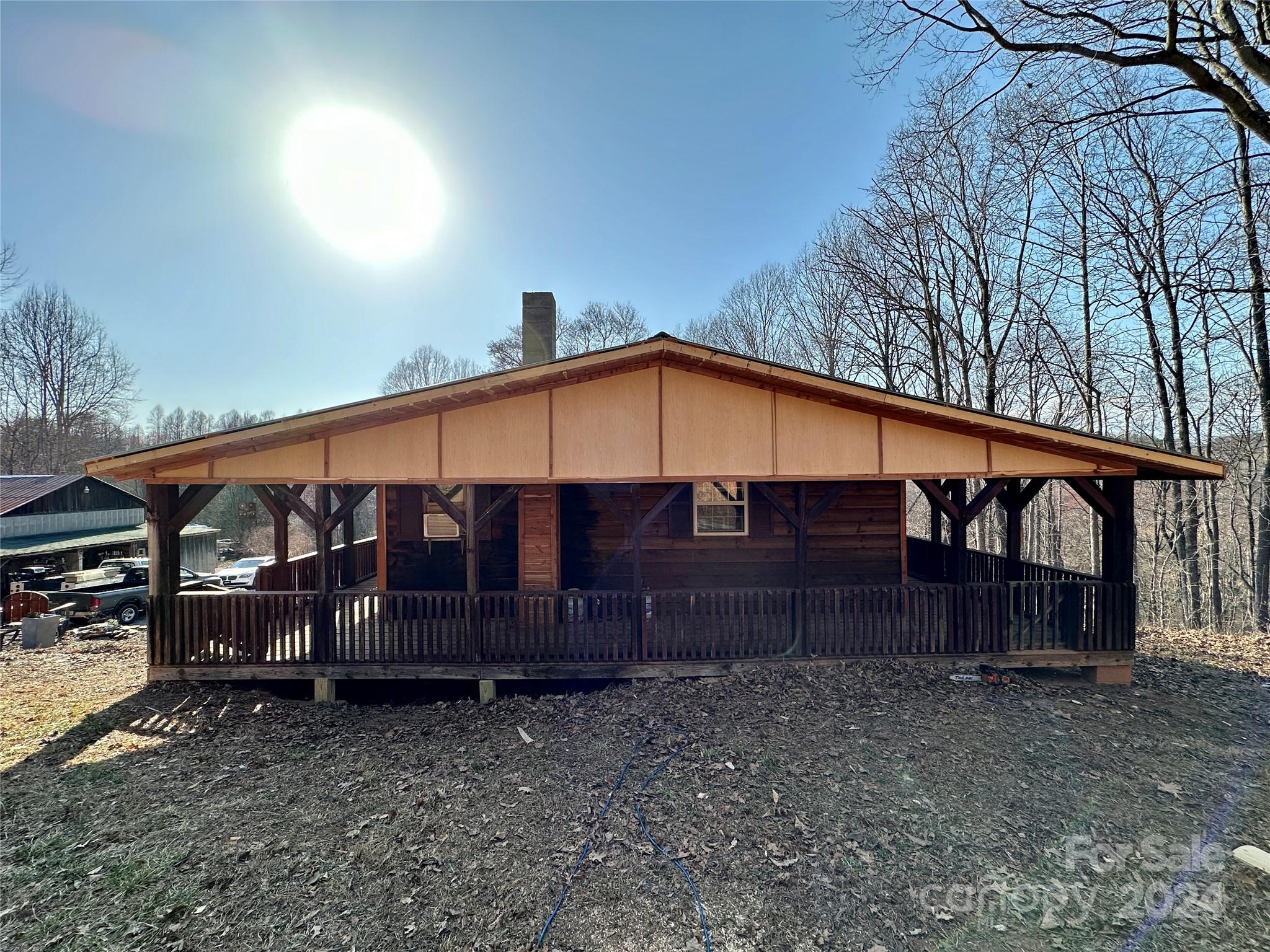 4453 Scott Road Morganton, NC 28655 - Photo 10 of 44 a front view of a house with a yard and wooden fence
