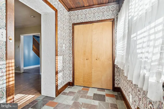 a view of a bathroom with wooden floor and a shower