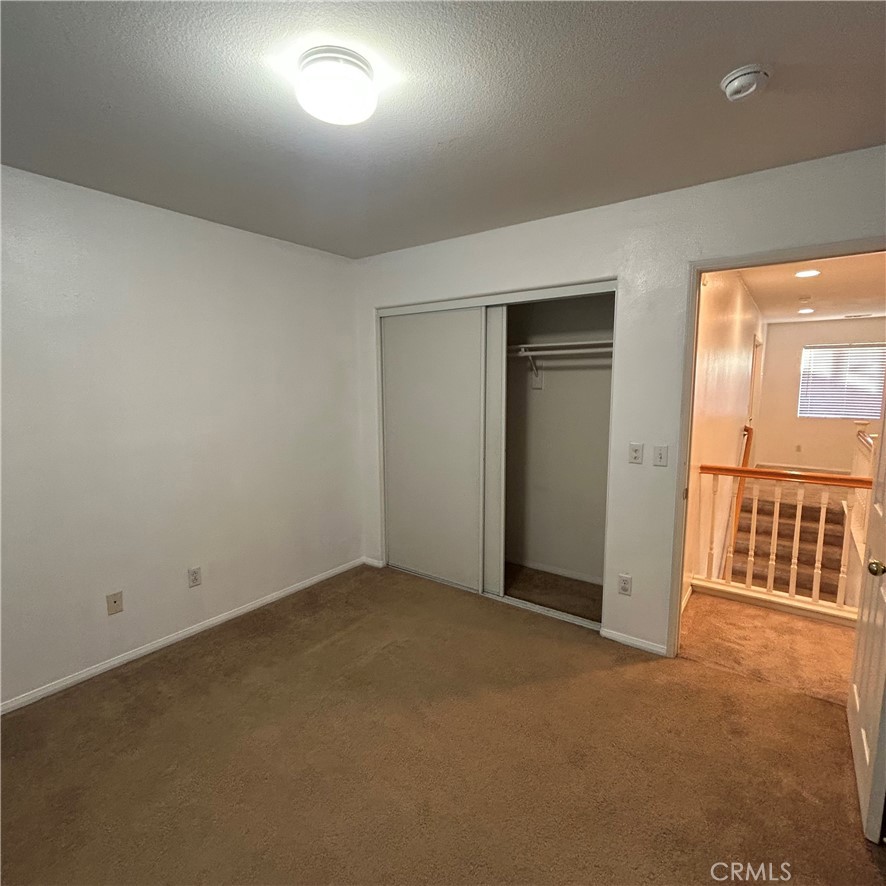 1538 Apple Canyon Road Beaumont, CA 92223 - Photo 16 of 23 an empty room with windows & cabinet