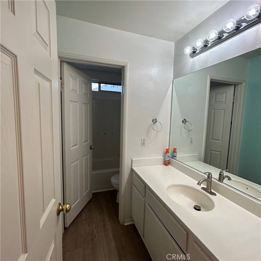 1538 Apple Canyon Road Beaumont, CA 92223 - Photo 17 of 23 a bathroom with a double vanity sink a mirror and shower