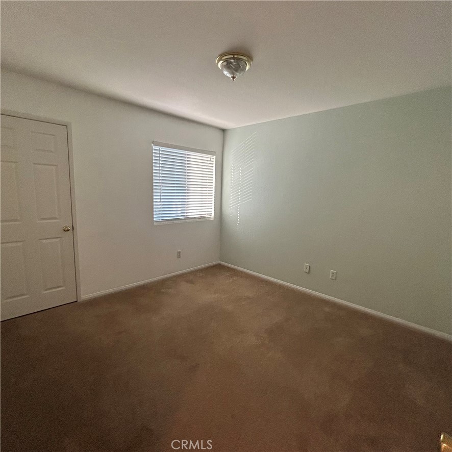 1538 Apple Canyon Road Beaumont, CA 92223 - Photo 19 of 23 an empty room with a window
