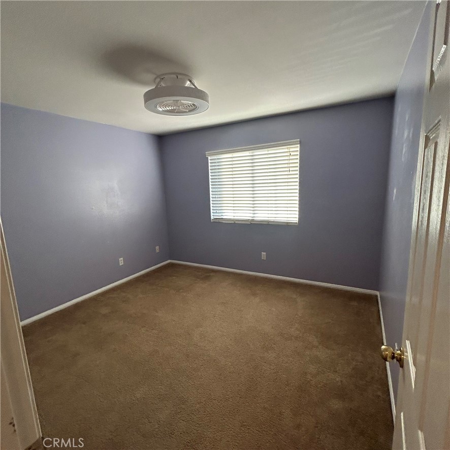 1538 Apple Canyon Road Beaumont, CA 92223 - Photo 20 of 23 an empty room with a empty space and windows